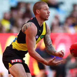 MELBOURNE, AUSTRALIA - MAY 11: Nathan Broad of the Tigers handballs during the round nine AFL match between Richmond Tigers and West Coast Eagles at Melbourne Cricket Ground, on May 11, 2025, in Melbourne, Australia. (Photo by Morgan Hancock/AFL Photos/via Getty Images)