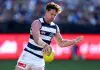 GEELONG, AUSTRALIA - MAY 11: Jed Bews of the Cats kicks during the round nine AFL match between Geelong Cats and GWS Giants at GMHBA Stadium, on May 11, 2025, in Geelong, Australia. (Photo by Josh Chadwick/Getty Images)
