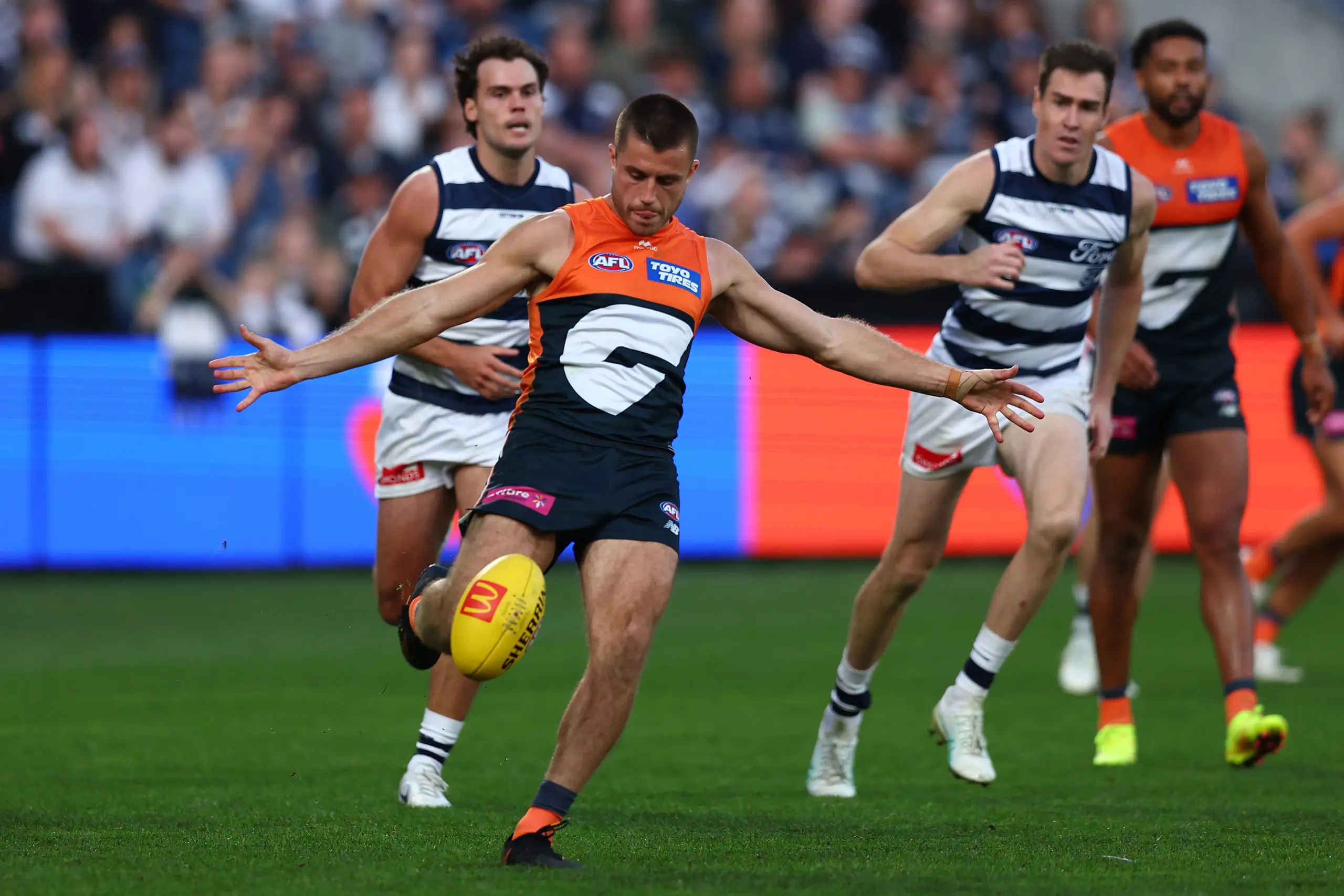 GEELONG, AUSTRALIA - MAY 11: Xavier O'Halloran of the Giants kicks during the round nine AFL match between Geelong Cats and GWS Giants at GMHBA Stadium on May 11, 2025 in Geelong, Australia. (Photo by Graham Denholm/AFL Photos/Getty Images)