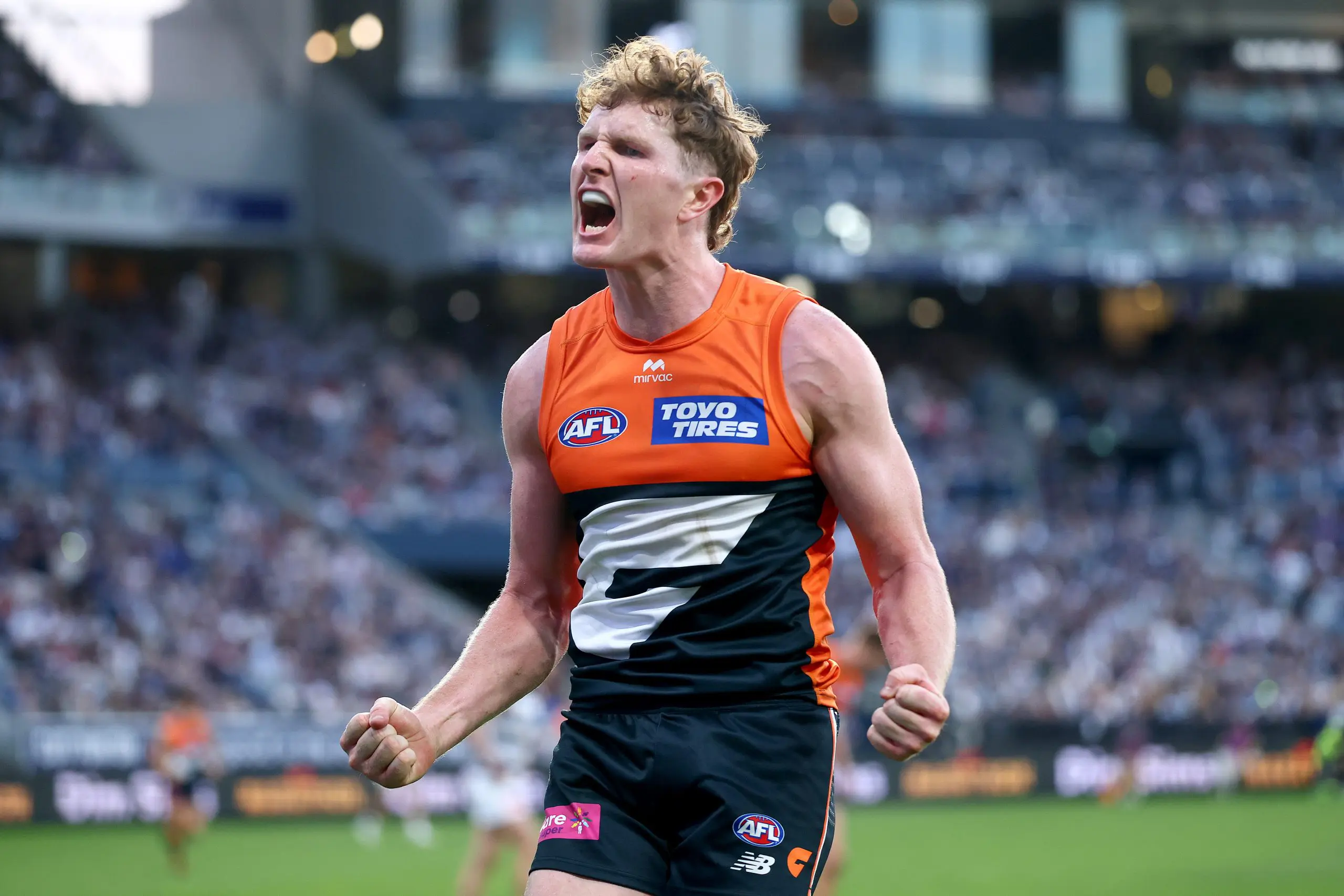 GEELONG, AUSTRALIA - MAY 11: Tom Green of the Giants celebrates kicking a goal during the round nine AFL match between Geelong Cats and GWS Giants at GMHBA Stadium, on May 11, 2025, in Geelong, Australia. (Photo by Josh Chadwick/Getty Images)