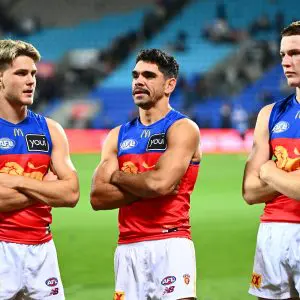 HOBART, AUSTRALIA - MAY 11: Will Ashcroft, Charlie Cameron and Logan Morris of the Lions looks dejected after the game ends in a draw during the round nine AFL match between North Melbourne Kangaroos and Brisbane Lions at Ninja Stadium, on May 11, 2025, in Hobart, Australia. (Photo by Steve Bell/Getty Images)