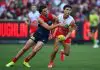 MELBOURNE, AUSTRALIA - MAY 25: Harvey Langford of the Demons tackles Sam Wicks of the Swans during the round 11 AFL match between Narrm (Melbourne Demons) and Sydney Swans at Melbourne Cricket Ground, on May 25, 2025, in Melbourne, Australia. (Photo by Quinn Rooney/Getty Images)
