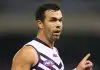 Former AFL player charged with assaulting