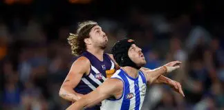 MELBOURNE, AUSTRALIA - MARCH 23: Luke Jackson of the Dockers and Tristan Xerri of the Kangaroos compete in a ruck contest during the 2024 AFL Round 2 match between the North Melbourne Kangaroos and the Fremantle Dockers on March 23, 2024 in Melbourne, Australia. (Photo by Dylan Burns/AFL Photos via Getty Images)