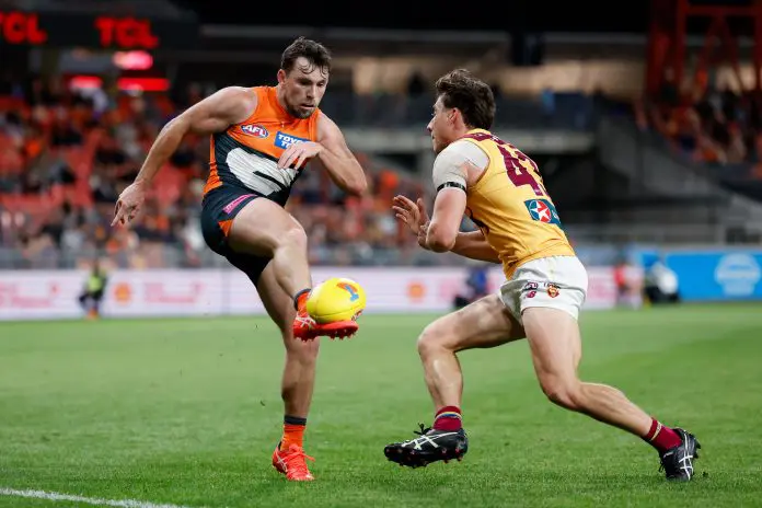 SYDNEY, AUSTRALIA - SEPTEMBER 14: Brent Daniels of the Giants kicks the ball during the 2024 AFL First Semi Final match between the GWS GIANTS and the Brisbane Lions at ENGIE Stadium on September 14, 2024 in Sydney, Australia. (Photo by Dylan Burns/AFL Photos via Getty Images)