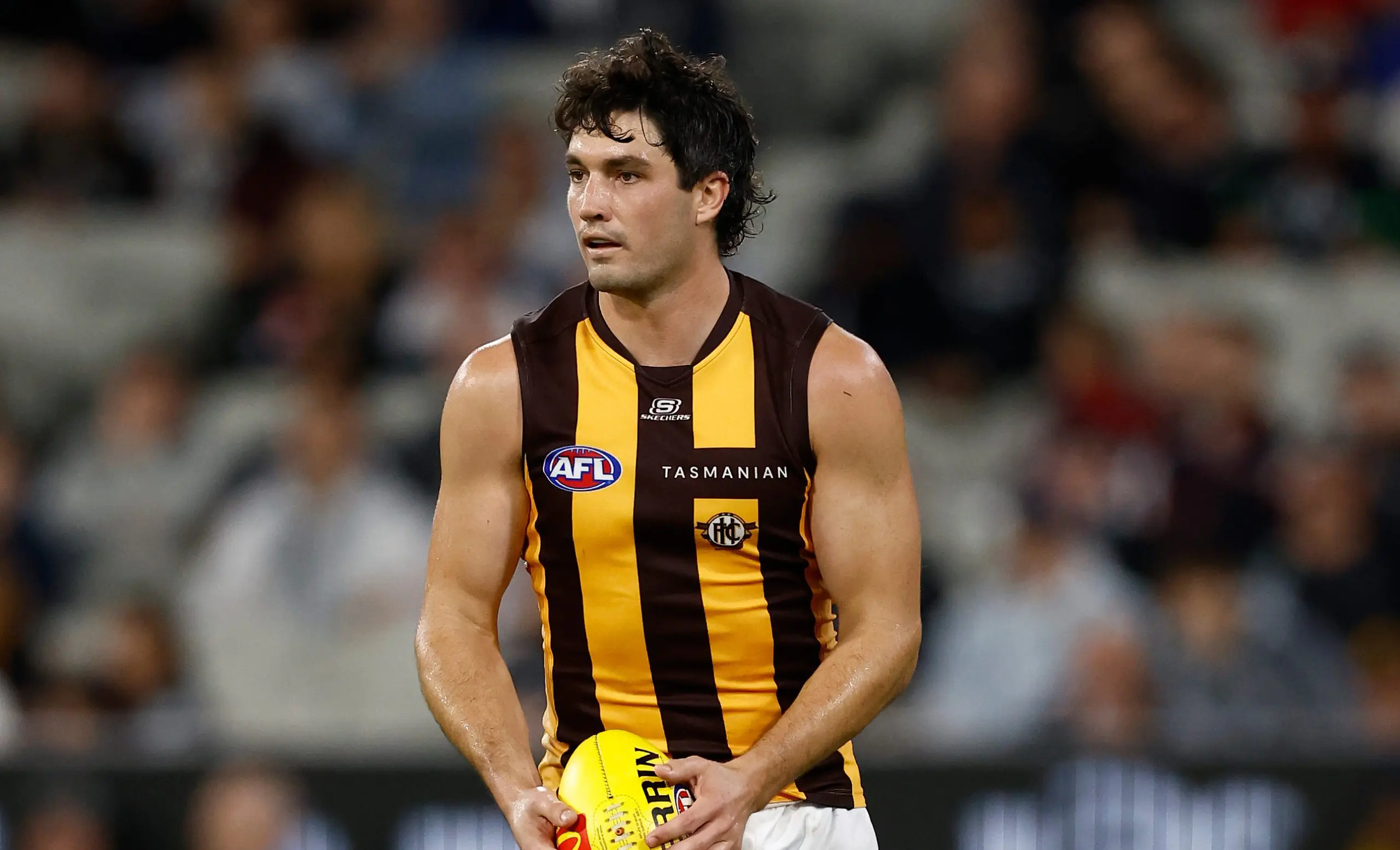 MELBOURNE, AUSTRALIA - MARCH 20: Tom Barrass of the Hawks in action during the 2025 AFL Round 02 match between the Carlton Blues and the Hawthorn Hawks at the Melbourne Cricket Ground on March 20, 2025 in Melbourne, Australia. (Photo by Michael Willson/AFL Photos via Getty Images)