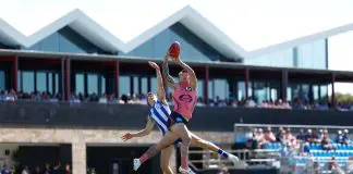 LYNDOCH, AUSTRALIA - APRIL 12: Bailey Humphrey of the Suns and Finn O'Sullivan of the Kangaroos in action during the 2025 AFL Round 05 match between the North Melbourne Kangaroos and the Gold Coast Suns at Barossa Park on April 12, 2025 in Lyndoch, Australia. (Photo by Michael Willson/AFL Photos via Getty Images)