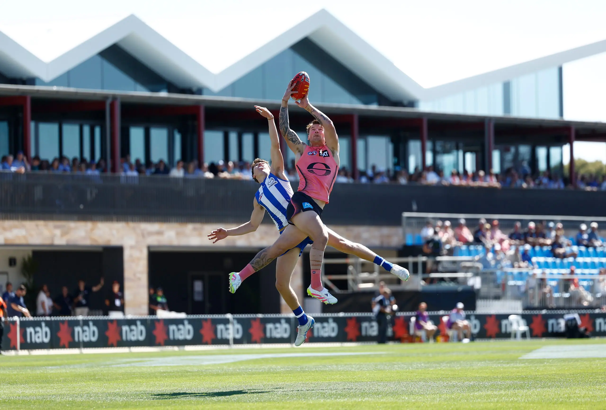 LYNDOCH, AUSTRALIA - APRIL 12: Bailey Humphrey of the Suns and Finn O'Sullivan of the Kangaroos in action during the 2025 AFL Round 05 match between the North Melbourne Kangaroos and the Gold Coast Suns at Barossa Park on April 12, 2025 in Lyndoch, Australia. (Photo by Michael Willson/AFL Photos via Getty Images)