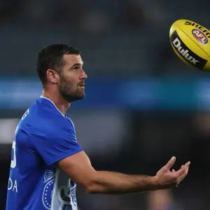 MELBOURNE, AUSTRALIA - APRIL 18: Jack Darling of the Kangaroos warms up ahead of the round six AFL match between North Melbourne Kangaroos and Carlton Blues at Marvel Stadium, on April 18, 2025, in Melbourne, Australia. (Photo by Daniel Pockett/Getty Images)