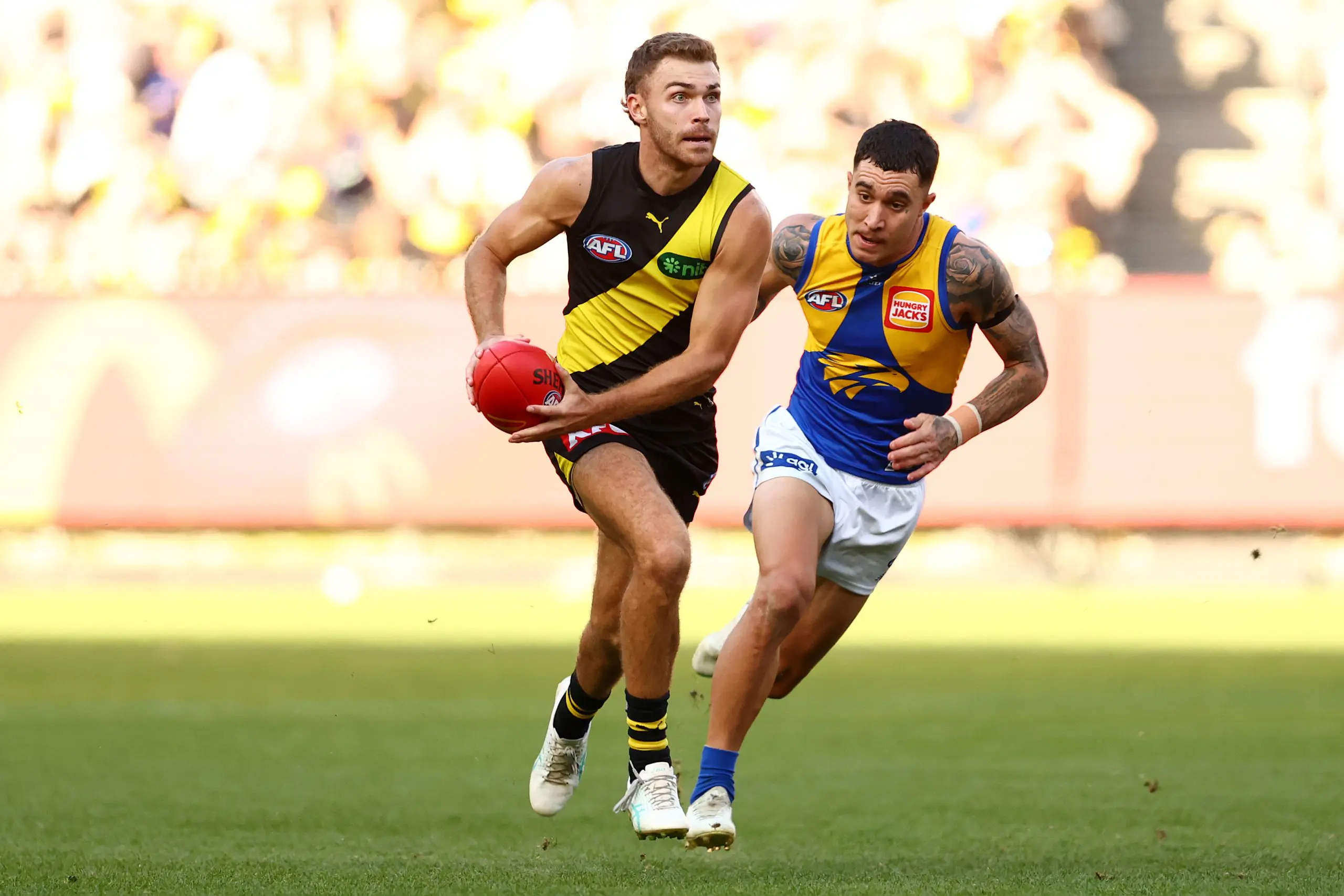 MELBOURNE, AUSTRALIA - MAY 11: Sam Banks of the Tigers runs with the ball during the round nine AFL match between Richmond Tigers and West Coast Eagles at Melbourne Cricket Ground, on May 11, 2025, in Melbourne, Australia. (Photo by Morgan Hancock/AFL Photos/via Getty Images)