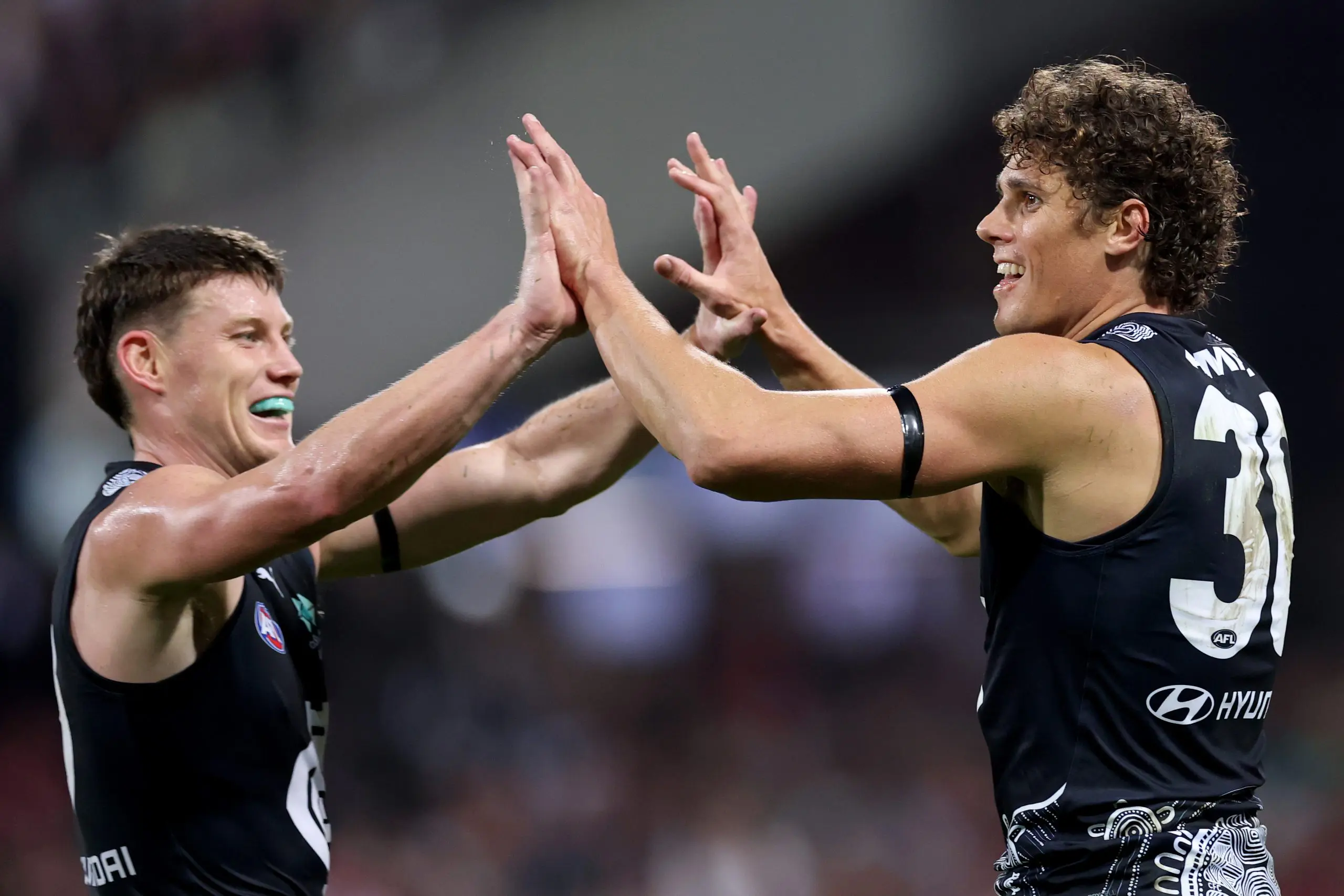 SYDNEY, AUSTRALIA - MAY 16: Charlie Curnow of the Blues is congratulated by Sam Walsh after kicking a goal during the round ten AFL match between Sydney Swans and Carlton Blues at Sydney Cricket Ground, on May 16, 2025, in Sydney, Australia. (Photo by Cameron Spencer/Getty Images)