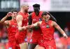 GOLD COAST, AUSTRALIA - MAY 31: Leo Lombard of the Suns celebrates with team mates after kicking a goal during the round 12 AFL match between Gold Coast Suns and Fremantle Dockers at People First Stadium, on May 31, 2025, in Gold Coast, Australia. (Photo by Chris Hyde/Getty Images)