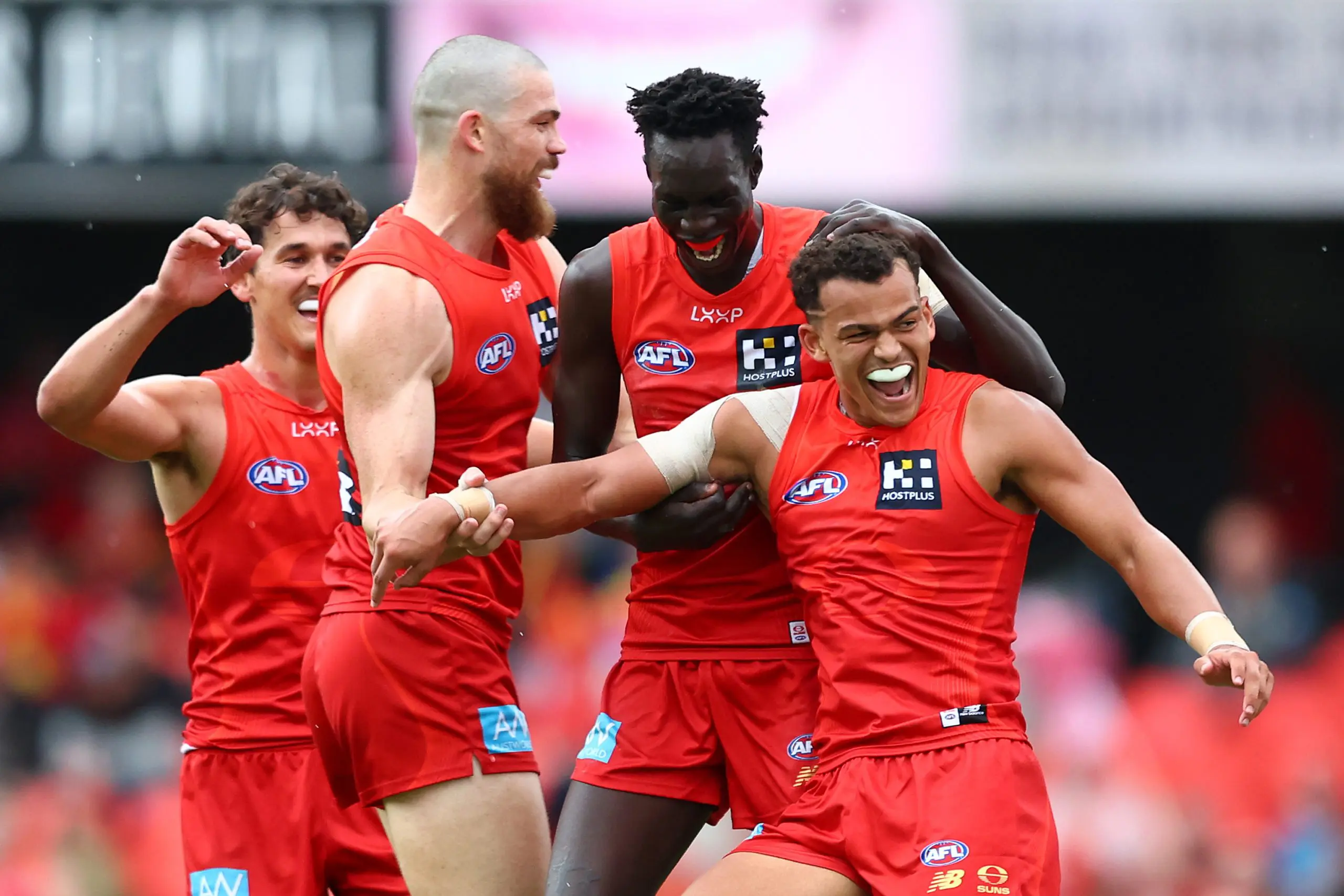 GOLD COAST, AUSTRALIA - MAY 31: Leo Lombard of the Suns celebrates with team mates after kicking a goal during the round 12 AFL match between Gold Coast Suns and Fremantle Dockers at People First Stadium, on May 31, 2025, in Gold Coast, Australia. (Photo by Chris Hyde/Getty Images)