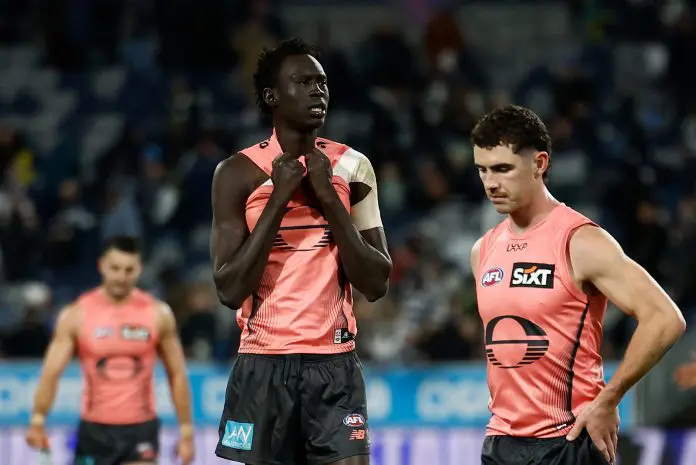 GEELONG, AUSTRALIA - JUNE 07: Sam Flanders (right) and Mac Andrew of the Suns look dejected after a loss during the 2025 AFL Round 13 match between the Geelong Cats and the Gold Coast Suns at GMHBA Stadium on June 7, 2025 in Geelong, Australia. (Photo by Michael Willson/AFL Photos via Getty Images)