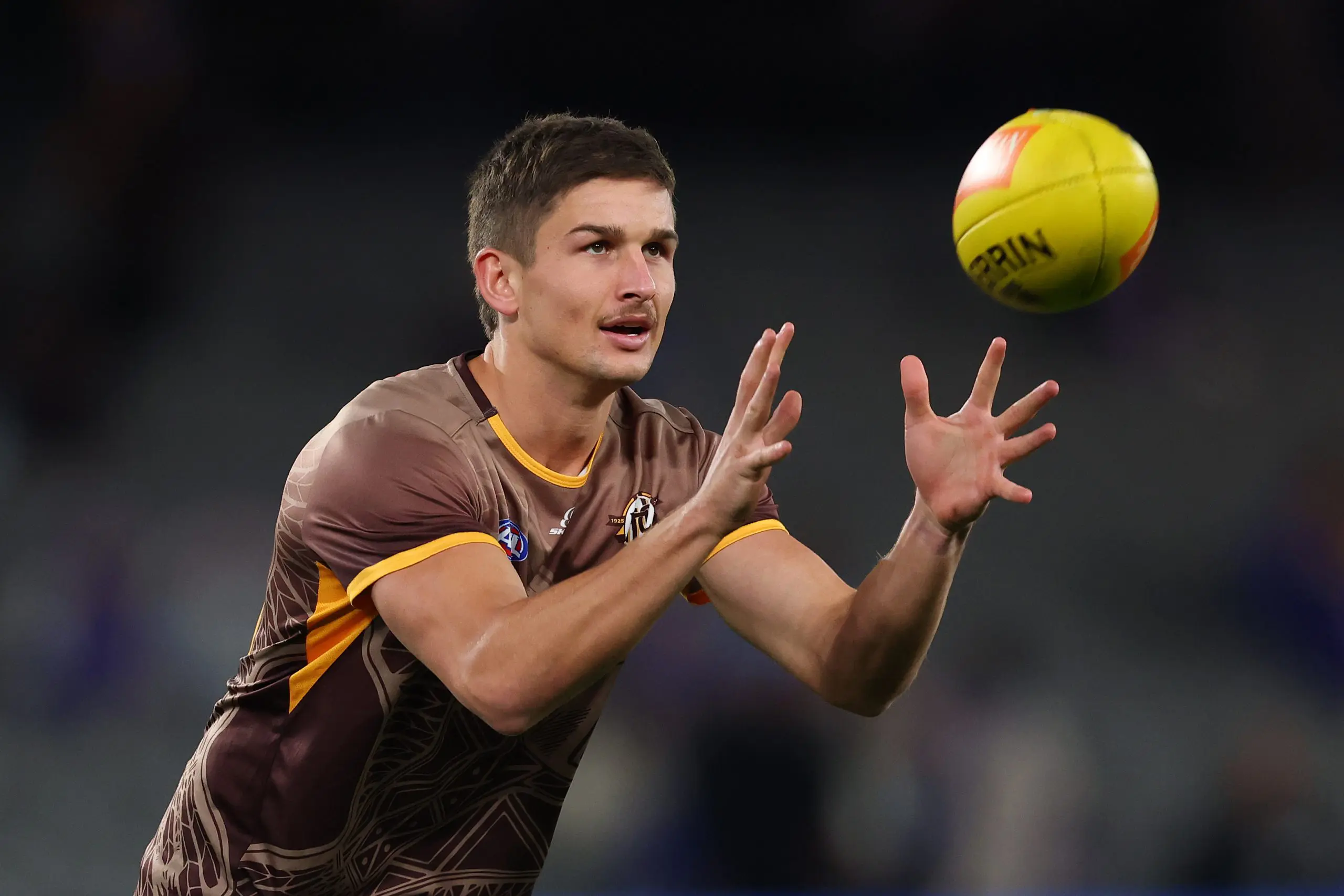 MELBOURNE, AUSTRALIA - JUNE 05: Sam Butler of the Hawks warms up ahead of the round 13 AFL match between Western Bulldogs and Hawthorn Hawks at Marvel Stadium, on June 05, 2025, in Melbourne, Australia. (Photo by Morgan Hancock/Getty Images)