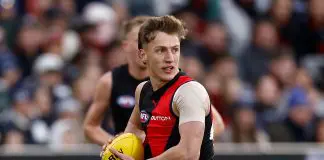 MELBOURNE, AUSTRALIA - JUNE 14: Zak Johnson of the Bombers in action during the 2025 AFL Round 14 match between the Essendon Bombers and the Geelong Cats at the Melbourne Cricket Ground on June 14, 2025 in Melbourne, Australia. (Photo by Michael Willson/AFL Photos via Getty Images)