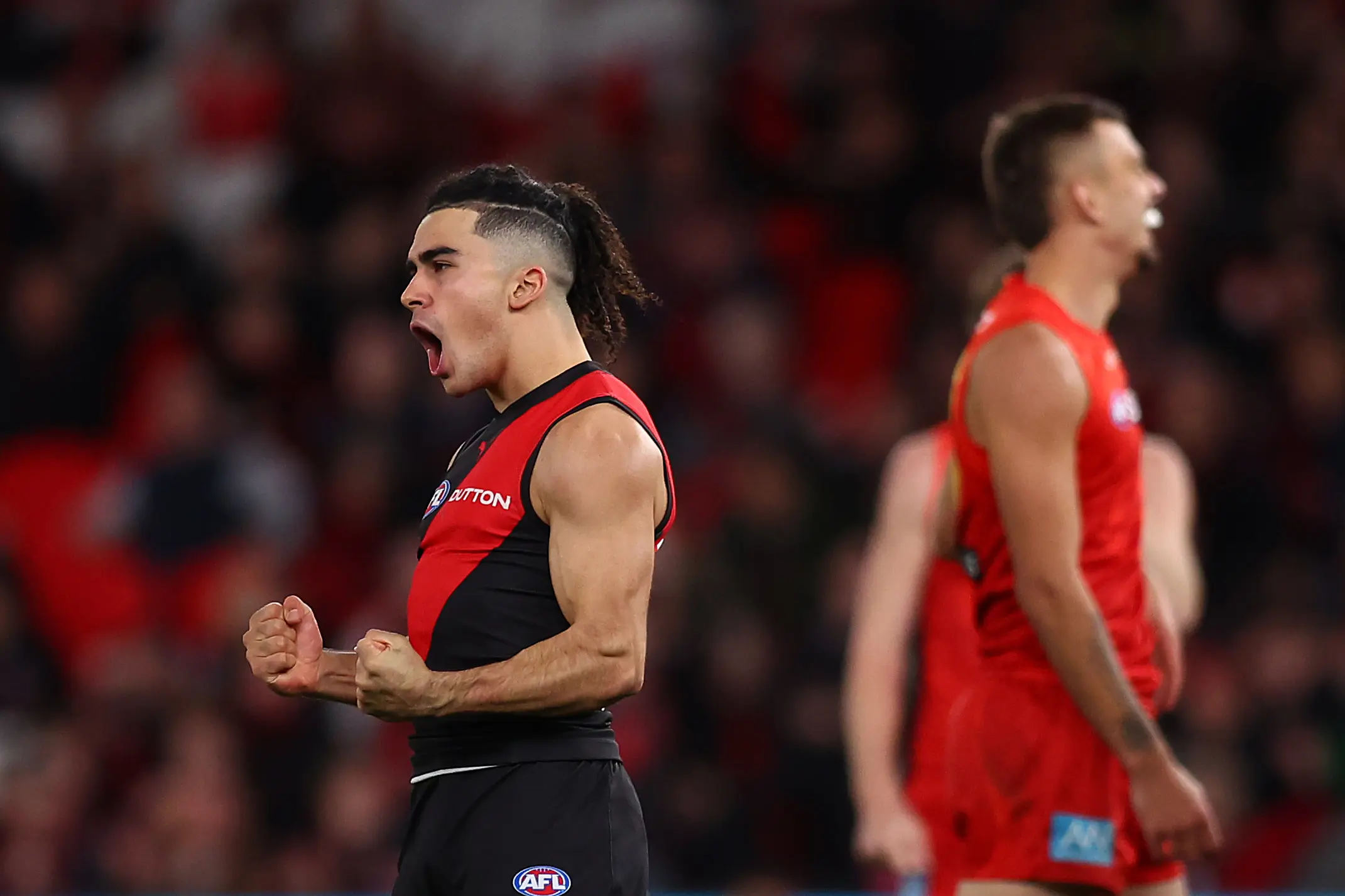 MELBOURNE, AUSTRALIA - JULY 05: Isaac Kako of the Bombers celebrates kicking a goalduring the round 17 AFL match between Essendon Bombers and Gold Coast Suns at Marvel Stadium on July 05, 2025 in Melbourne, Australia. (Photo by Graham Denholm/AFL Photos)