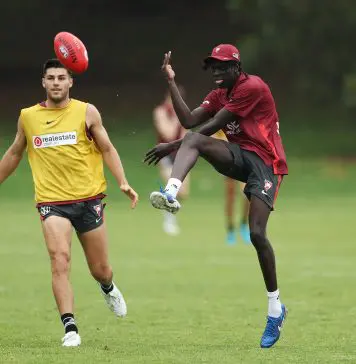 SYDNEY, AUSTRALIA - NOVEMBER 29: Riak Andrew kicks during a Sydney Swans Training Session at Bat and Ball Oval on November 29, 2024 in Sydney, Australia. (Photo by Matt King/Getty Images)