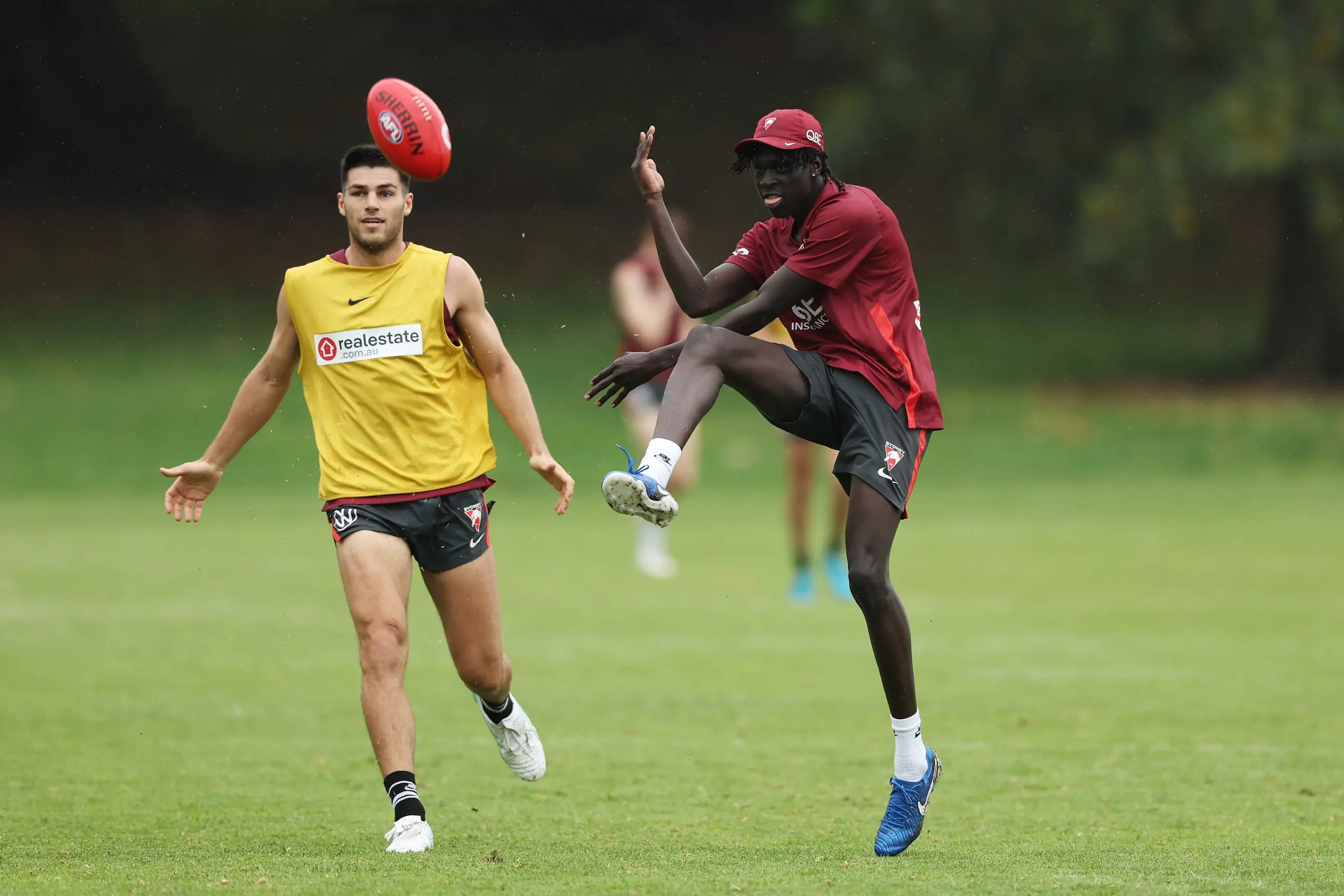 SYDNEY, AUSTRALIA - NOVEMBER 29: Riak Andrew kicks during a Sydney Swans Training Session at Bat and Ball Oval on November 29, 2024 in Sydney, Australia. (Photo by Matt King/Getty Images)