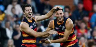 ADELAIDE, AUSTRALIA - MAY 03: Alex Neal-Bullen of the Crows 
 celebrates a goal  with  Isaac Cumming of the Crows during the round eight AFL match between Adelaide Crows and Carlton Blues at Adelaide Oval, on May 03, 2025, in Adelaide, Australia. (Photo by Mark Brake/Getty Images)