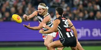 Footy form guide: How do the AFL flag fancies shape up? MELBOURNE, AUSTRALIA - MAY 03: Bailey Smith of the Cats handballs whilst being tackled during the round eight AFL match between Collingwood Magpies and Geelong Cats at Melbourne Cricket Ground, on May 03, 2025, in Melbourne, Australia. (Photo by Quinn Rooney/Getty Images)