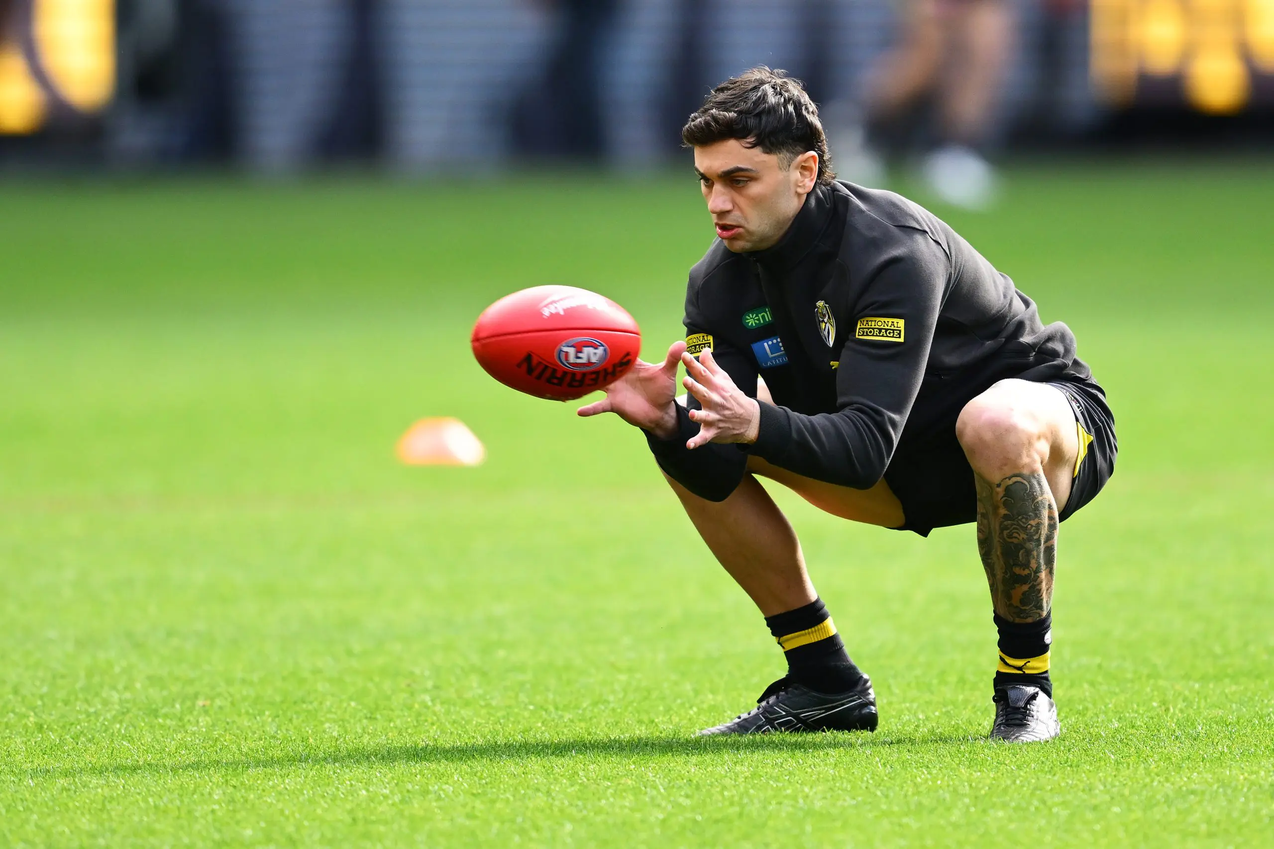 MELBOURNE, AUSTRALIA - JUNE 07: Tim Taranto of the Tigers warms up ahead ofthe round 13 AFL match between Richmond Tigers and Sydney Swans at Melbourne Cricket Ground, on June 07, 2025, in Melbourne, Australia. (Photo by Quinn Rooney/Getty Images)