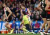 MELBOURNE, AUSTRALIA - JUNE 12: Curtis Deboy, AFL Field Umpire and Rhylee West of the Bulldogs come into contact during the 2025 AFL Round 14 match between the St Kilda Saints and the Western Bulldogs at Marvel Stadium on June 12, 2025 in Melbourne, Australia. (Photo by Michael Willson/AFL Photos via Getty Images)