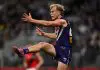 EXCLUSIVE: Breakout Docker has courage coursing through his DNA PERTH, AUSTRALIA - JUNE 19: Karl Worner of the Dockers kicks the ball during the 2025 AFL Round 15 match between the Fremantle Dockers and the Essendon Bombers at Optus Stadium on June 19, 2025 in Perth, Australia. (Photo by Daniel Carson/AFL Photos via Getty Images)