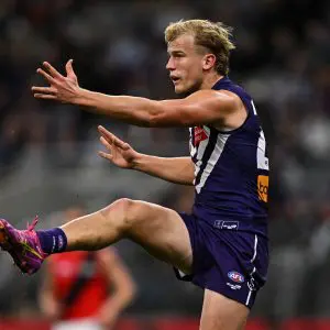 PERTH, AUSTRALIA - JUNE 19: Karl Worner of the Dockers kicks the ball during the 2025 AFL Round 15 match between the Fremantle Dockers and the Essendon Bombers at Optus Stadium on June 19, 2025 in Perth, Australia. (Photo by Daniel Carson/AFL Photos via Getty Images)