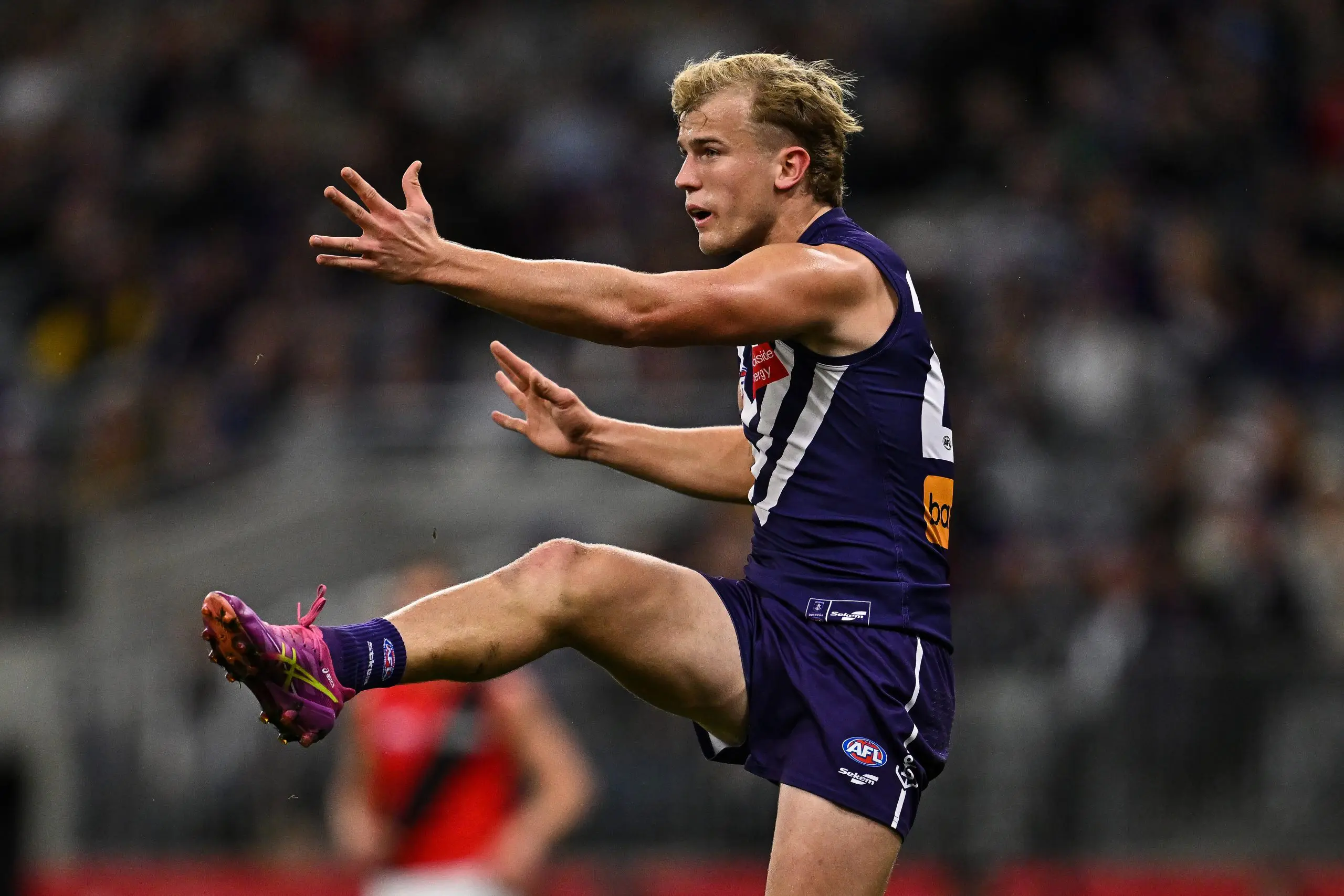PERTH, AUSTRALIA - JUNE 19: Karl Worner of the Dockers kicks the ball during the 2025 AFL Round 15 match between the Fremantle Dockers and the Essendon Bombers at Optus Stadium on June 19, 2025 in Perth, Australia. (Photo by Daniel Carson/AFL Photos via Getty Images)