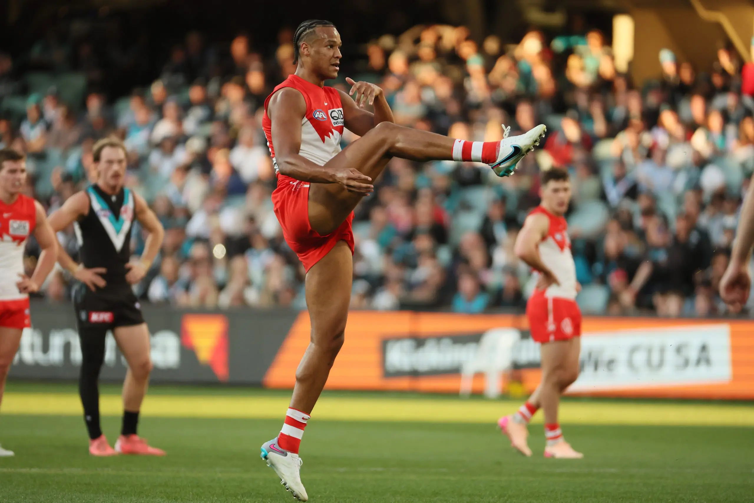 ADELAIDE, AUSTRALIA - JUNE 21: Joel Amartey of the Swans kicks the ball during the 2025 AFL Round 15 match between the Port Adelaide Power and the Sydney Swans at Adelaide Oval on June 21, 2025 in Adelaide, Australia. (Photo by James Elsby/AFL Photos via Getty Images)