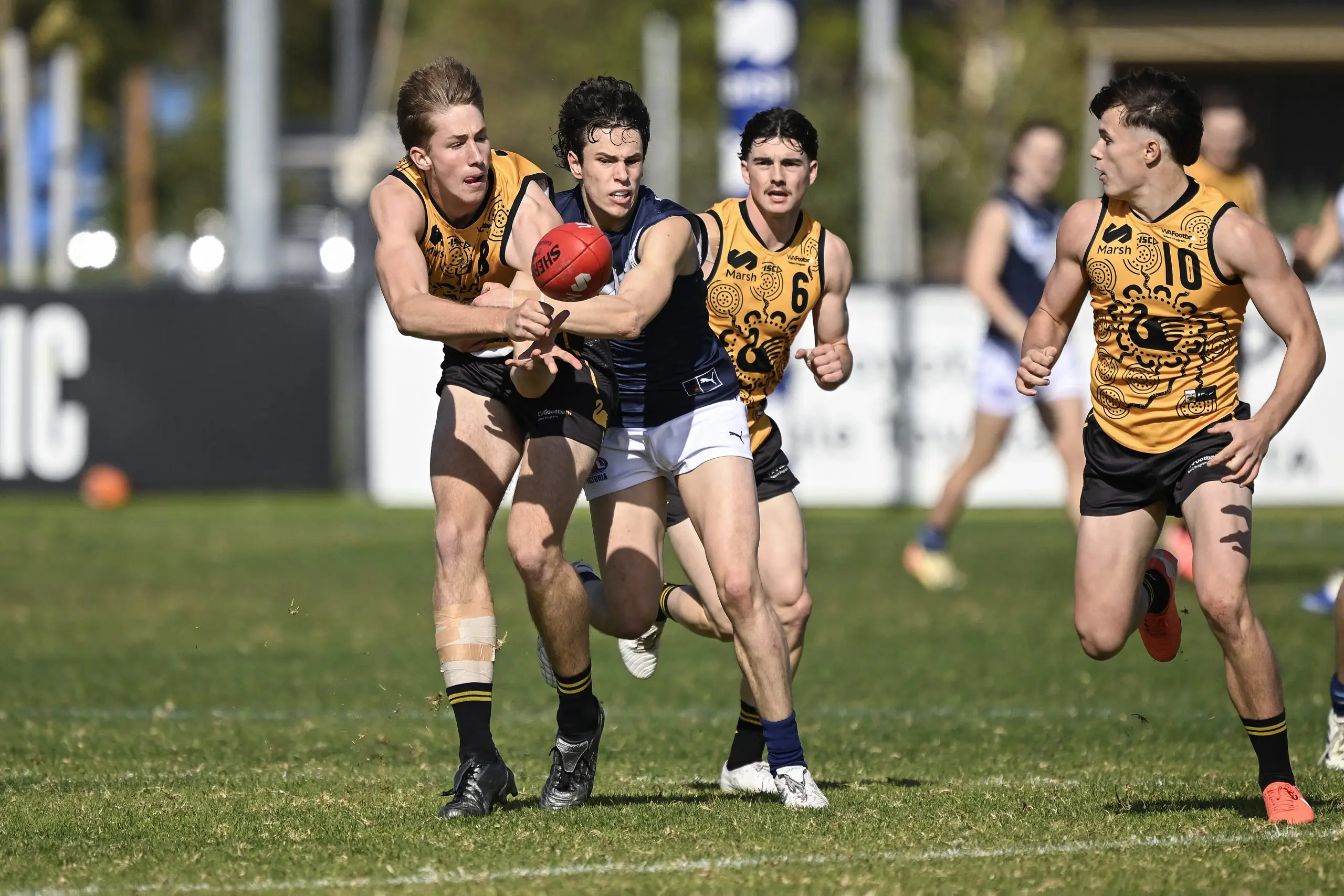 PERTH, AUSTRALIA - JULY 06: Benji van Rooyen of Western Australia handballs during the Marsh AFL National Championships U18 Boys match between Western Australia and Victoria Metro at The Good Grocer Park, on July 06, 2025, in Perth, Australia. (Photo by Stefan Gosatti/AFL Photos/via Getty Images)
