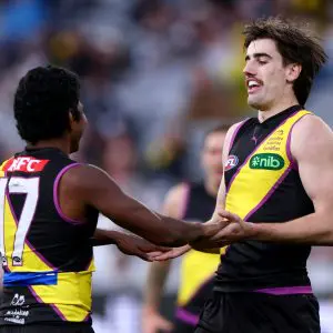 MELBOURNE, AUSTRALIA - JULY 27: Jonty Faull of the Tigers is congratulated by Maurice Rioli after kicking a goal during the round 20 AFL match between Richmond Tigers and Collingwood Magpies at Melbourne Cricket Ground on July 27, 2025 in Melbourne, Australia. (Photo by Daniel Pockett/Getty Images)