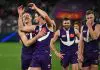 FREMANTLE, AUSTRALIA - AUGUST 03: Brennan Cox and Jye Amiss of the Dockers celebrate the win during the 2025 AFL Round 21 match between the Fremantle Dockers and the Carlton Blues at Optus Stadium on August 3, 2025 in Fremantle, Australia. (Photo by Daniel Carson/AFL Photos via Getty Images)