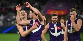 FREMANTLE, AUSTRALIA - AUGUST 03: Brennan Cox and Jye Amiss of the Dockers celebrate the win during the 2025 AFL Round 21 match between the Fremantle Dockers and the Carlton Blues at Optus Stadium on August 3, 2025 in Fremantle, Australia. (Photo by Daniel Carson/AFL Photos via Getty Images)
