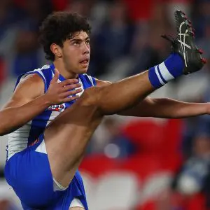 MELBOURNE, AUSTRALIA - AUGUST 23: Cooper Trembath of the Kangaroos kicks the ball during the round 24 AFL match between North Melbourne Kangaroos and Adelaide Crows at Marvel Stadium on August 23, 2025 in Melbourne, Australia. (Photo by Morgan Hancock/Getty Images)