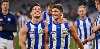 PERTH, AUSTRALIA - JUNE 08: Jy Simpkin and Harry Sheezel of the Kangaroos are happy with the win during the 2024 AFL Round 12 match between the West Coast Eagles and the North Melbourne Kangaroos at Optus Stadium on June 08, 2024 in Perth, Australia. (Photo by Daniel Carson/AFL Photos via Getty Images)