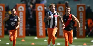MELBOURNE, AUSTRALIA - SEPTEMBER 28: (L-R) Orazio Fantasia of Carlton, Beau McCreery of Collingwood, Ben Hobbs of Essendon  compete in the AFL Grand Final 100m sprint ahead of the AFL Grand Final match between Sydney Swans and Brisbane Lions at Melbourne Cricket Ground, on September 28, 2024, in Melbourne, Australia. (Photo by Quinn Rooney/Getty Images)
