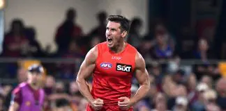 BRISBANE, AUSTRALIA - MAY 04: David Swallow of the Suns celebrates kicking a goal during the round eight AFL match between Brisbane Lions and Gold Coast Suns at The Gabba, on May 04, 2025, in Brisbane, Australia. (Photo by Bradley Kanaris/Getty Images)