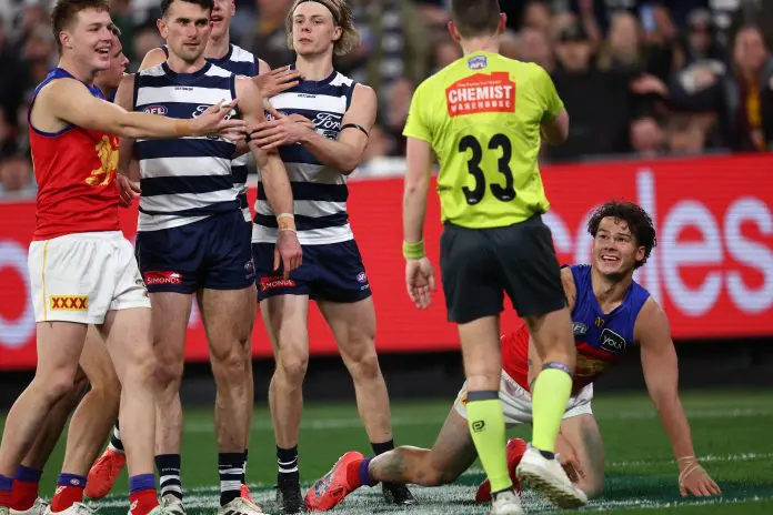 MELBOURNE, AUSTRALIA - SEPTEMBER 05: Cam Rayner of the Lions gets a free kick fro Zach Guthrie of the Cats during the AFL Second Qualifying Final match between the Geelong Cats and the Brisbane Lions at the Melbourne Cricket Ground on September 05, 2025 in Melbourne, Australia. (Photo by James Wiltshire/AFL Photos via Getty Images)