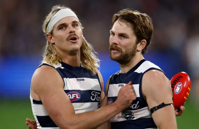 MELBOURNE, AUSTRALIA - SEPTEMBER 05: Bailey Smith (left) and Tom Atkins of the Cats celebrate during the AFL Second Qualifying Final match between the Geelong Cats and the Brisbane Lions at the Melbourne Cricket Ground on September 05, 2025 in Melbourne, Australia. (Photo by Michael Willson/AFL Photos via Getty Images)