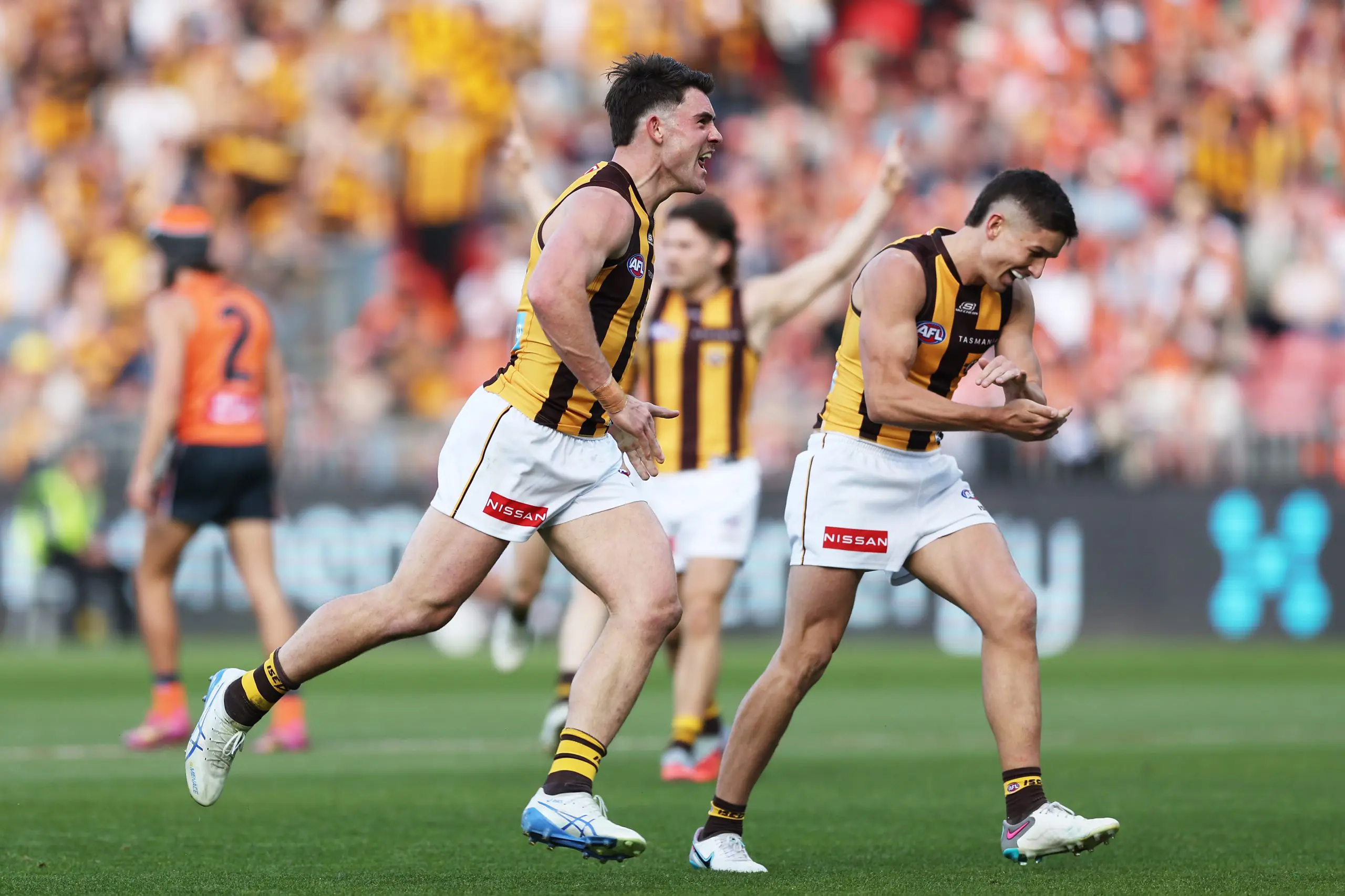 SYDNEY, AUSTRALIA - SEPTEMBER 06: Jai Newcombe of the Hawks celebrates with team mates after kicking a goal during the AFL Elimination Final match between Greater Western Sydney Giants and Hawthorn Hawks at ENGIE Stadium on September 06, 2025 in Sydney, Australia. (Photo by Matt King/AFL Photos/via Getty Images)