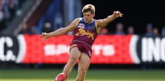 MELBOURNE, AUSTRALIA - SEPTEMBER 27: Zac Bailey of the Lions kicks the ball during the AFL Grand Final match between the Geelong Cats and the Brisbane Lions at the Melbourne Cricket Ground on September 27, 2025 in Melbourne, Australia. (Photo by Michael Willson/AFL Photos via Getty Images)