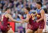 MELBOURNE, AUSTRALIA - SEPTEMBER 27: (L-R) Josh Dunkley, Zac Bailey and Cam Rayner of the Lions celebrate during the AFL Grand Final match between the Geelong Cats and the Brisbane Lions at the Melbourne Cricket Ground on September 27, 2025 in Melbourne, Australia. (Photo by Michael Willson/AFL Photos via Getty Images)