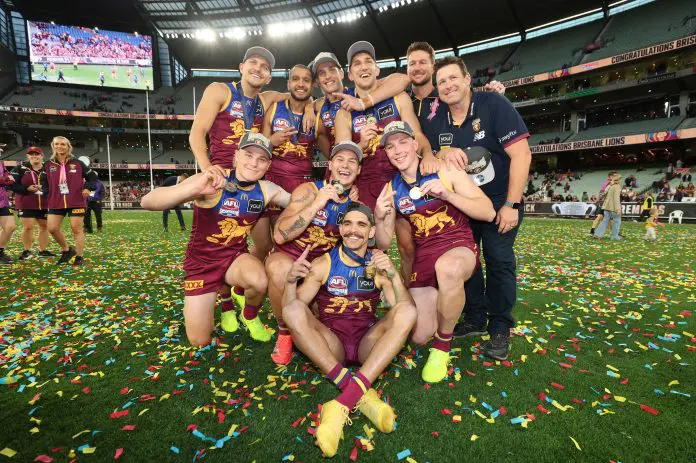 MELBOURNE, AUSTRALIA - SEPTEMBER 27: Levi Ashcroft, Kai Lohmann, Callum Ah Chee, Ty Gallop, Cam Rayner, Charlie Cameron, Zac Bailey, Logan Morris, Stuart Dew during the AFL Grand Final match between the Geelong Cats and the Brisbane Lions at the Melbourne Cricket Ground on September 27, 2025 in Melbourne, Australia. (Photo by James Wiltshire/AFL Photos via Getty Images)