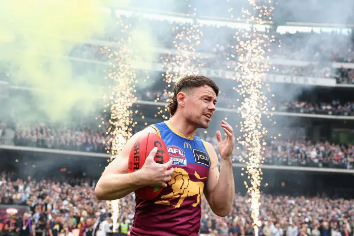 MELBOURNE, AUSTRALIA - SEPTEMBER 27: Lachie Neale of the Lions runs onto the field during the AFL Grand Final match between Geelong Cats and Brisbane Lions at Melbourne Cricket Ground on September 27, 2025 in Melbourne, Australia. (Photo by Cameron Spencer/AFL Photos/via Getty Images)
