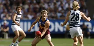 MELBOURNE, AUSTRALIA - SEPTEMBER 27: Will Ashcroft of the Lions handballs during the AFL Grand Final match between Geelong Cats and Brisbane Lions at Melbourne Cricket Ground on September 27, 2025 in Melbourne, Australia. (Photo by Darrian Traynor/Getty Images)