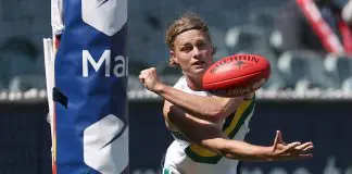 MELBOURNE, AUSTRALIA - SEPTEMBER 28: Jai Murray of Team Sloane handballs during the Marsh AFL National Futures Boys match between Team Heppell and Team Sloane at Melbourne Cricket Ground, on September 28, 2024, in Melbourne, Australia. (Photo by Daniel Pockett/AFL Photos/via Getty Images)