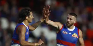 MELBOURNE, AUSTRALIA - MARCH 30: Jamarra Ugle-Hagan of the Bulldogs (L) celebrates with Marcus Bontempelli of the Bulldogs after kicking a goal during the round three AFL match between Western Bulldogs and Brisbane Lions at Marvel Stadium, on March 30, 2023, in Melbourne, Australia. (Photo by Daniel Pockett/Getty Images)