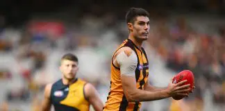 MELBOURNE, AUSTRALIA - JUNE 01: Ned Reeves of the Hawks takes possession of the ball during the round 12 AFL match between Hawthorn Hawks and Adelaide Crows at Melbourne Cricket Ground, on June 01, 2024, in Melbourne, Australia. (Photo by Morgan Hancock/AFL Photos/via Getty Images)